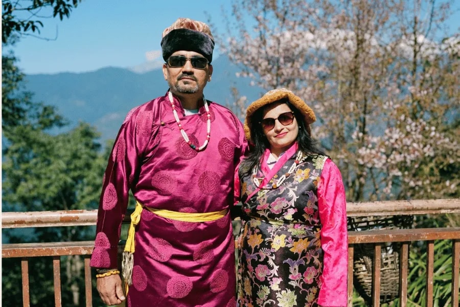 Travelers dressed in traditional Bhutanese clothing
