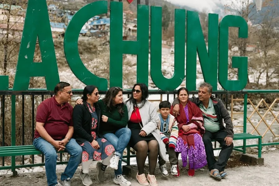 A family taking a break together in Lachung
