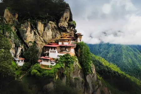 Bhutan’s Tiger’s Nest monastery perched on a cliff above a forested valley